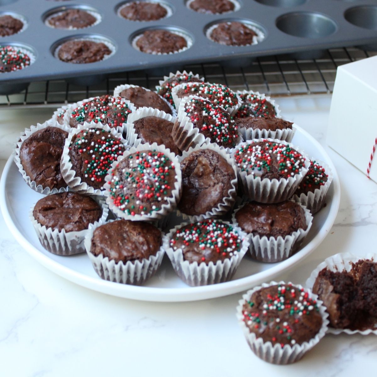 Brownie Bites in a Mini Muffin Pan These bite-size brownies bake up with crisp edges, gooey centers, and that rich chocolate flavor everyone loves. Perfect for holiday cookie trays, catering events, or an easy weeknight dessert. Brownie bites are simple to make, fun to decorate, and always a hit. Ingredients: 8 tablespoons unsalted butter (136 g), melted 1¼ cups granulated sugar (275 g) ¾ cup unsweetened cocoa powder (65 g) 2 large eggs, room temperature 1 large egg yolk 1 teaspoon vanilla extract (4 g) ½  cup all-purpose flour (45 g) ¼ teaspoon salt (1.5 g) ½ cup semi-sweet chocolate chips (70 g) Instructions: Preheat oven to 350°F. Grease a mini muffin pan or line with paper liners. In a medium saucepan, melt butter, then whisk in sugar and cocoa powder. Add eggs and yolk one at a time, followed by vanilla. Fold in flour and salt, then stir in chocolate chips. Scoop batter into muffin cups and bake 10–15 minutes, until a toothpick shows moist crumbs. Cool on a wire rack and enjoy.